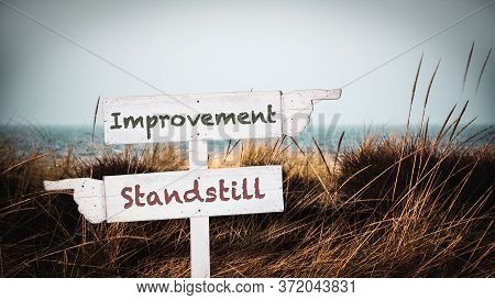 Street Sign The Direction Way To Improvement Versus Standstill