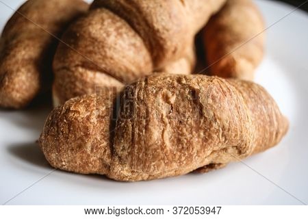 Croissants On A White Plate. Fresh Bakery