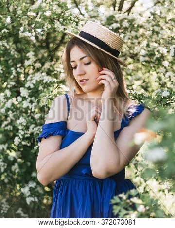 Sensual Calm Portrait Of Beautiful Hipster Woman In Blooming Bush With White Flowers Of Spirea. Copy