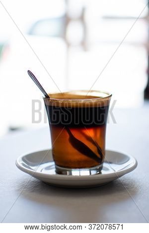 Coffee With Three Colors, Brown Black And Yellow With White Background
