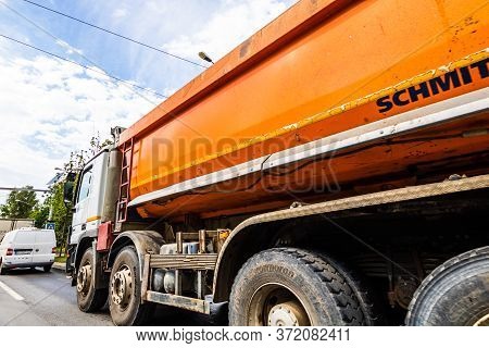Traffic With Road View Through Car Front Window, Dirty Schmitz Cargobull Tipper Trailer Truck In Tra