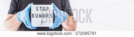 Fake News Infodemics During Covid-19 Pandemic Concept. Man Wearing Protective Mask And Medical Glove