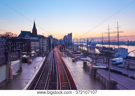 Landungsbrucken Station In Hamburg, Germany On A Sunrise, Early In The Morning, With Tracer Of Rear 
