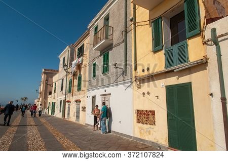 Alghero, Sardinia / Italy - April 10, 2011: Waterfront In The Coastal Town Of Alghero With Incidenta