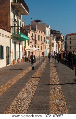 Alghero, Sardinia / Italy - April 10, 2011: Waterfront In The Coastal Town Of Alghero With Incidenta