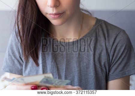 Woman Holding Euro Money In Her Hands. Economy And Financial Crisis. Saved Money. Financial Turmoil 