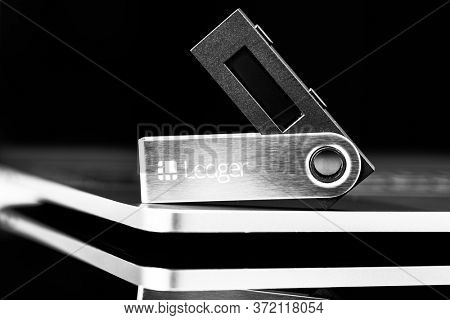 UKRAINE, ROVNO - On 8 October: Ledger hardware wallet for cryptocurrency on a black background
