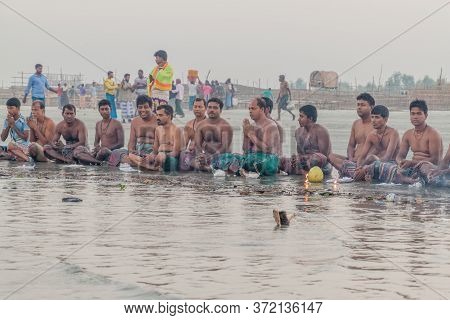 Dublar Char, Bangladesh - November 14, 2016: Hindu Devotees Praying Before Their Holy Dip During Ras