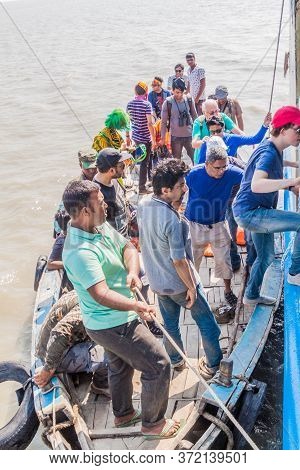Pasur, Bangladesh - November 14, 2016: Tourists Leaving A Boat And Boarding Their Ship During Their 
