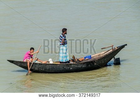 Katcha River, Bangladesh - November 19, 2016: Fishermen On A Small Boat On Katcha Kacha River, Bangl