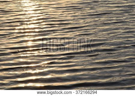 Relaxing Waves And Ripples Across The Surface Of The Baltic Sea At Sunset.