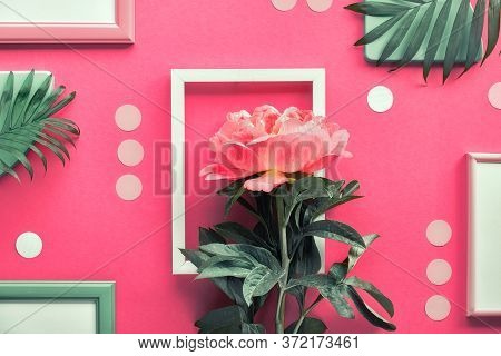 Creative Flat Lay With Coral Peony And Exotic Palm Leaves On Abstract Geometric Background With Fram