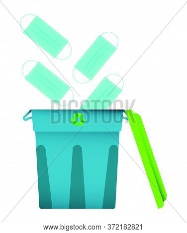 Used Medical Masks Fly Into The Bin, A Container For Recycling. End Of Pandemic, The Victory Over Th
