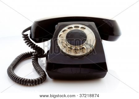 Retro roterende telefonen på en lys baggrund