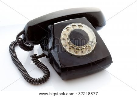 Retro roterende telefonen på en lys baggrund