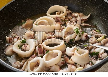 Squid Rings Made In Casserole As Sauce For Pasta Called Calamarata