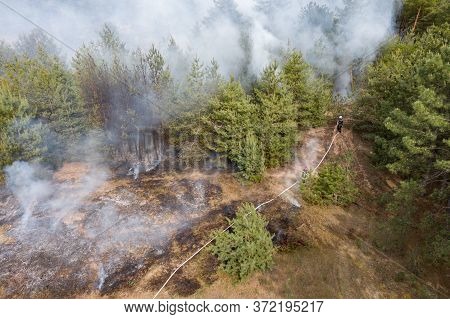 Aerial Drone View Of A Wildfire In Forested Area.