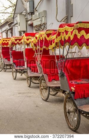 Many Typical Red Rickshaws In Beijing, China