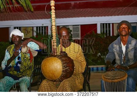 Senegal, Africa - Marsch Circa, 2016. Unidentified Black Men Playing Traditional African Music Durin