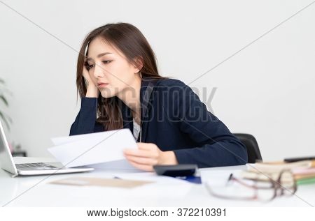 Overhelmed Tired Young Asian Woman Sitting At Her Desk Worker Wasting Time At Workplace Distracted F