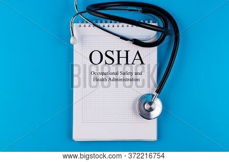 Osha Text Written In A Notebook Lying On A Desk And A Stethoscope. Medical Concept.