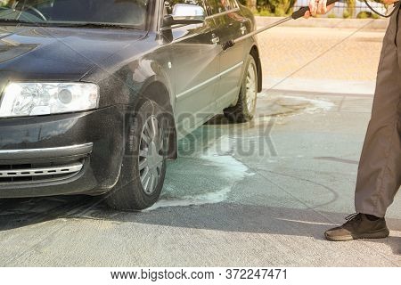 A Man Washes A Car In A Manual Car Wash. Clear Car