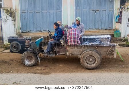 Hsipaw, Myanmar - December 3, 2016: Local People On A Tractor In A Village Near Hsipaw, Myanmar