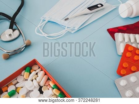 Colorful Tablets And Capsules In A Box, Thermometer, Statoscope, Medical Mask, Container, Vitamins, 
