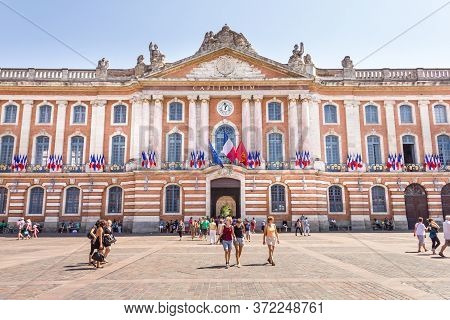 Toulouse, France- 17 August, 2013: People Walking In The Le Capitole Square. With 2 Hectares, The Ar