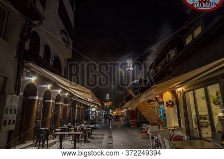 Sarajevo, Bosnia And Herzegovina - April 16, 2017: Street With Tourists And A Mosque Minaret In The 