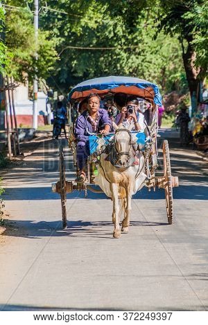 Inwa, Myanmar - December 5, 2016: Tourists In A Horse Cart In The Ancient Town Inwa Ava Near Mandala