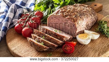 Homemade Ground Meatloaf With Eggs Tomatoes Celery Herbs And Thyme.