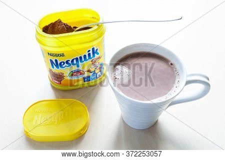 Moscow, Russia - June 16, 2020: Above View Of Open Jar Of Nesquik With Spoon And Mup With Cocoa On T