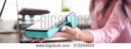 Girl In Workplace Holds Banking Mobile Device. Terms Use Trading Pos-terminal. Bank Acquirer Values 