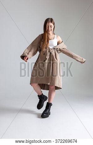 Attractive Caucasian Skinny Girl With Long Hair Posing On White Cyclorama. Beauty Portrait, Model Te