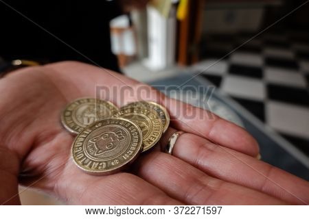 Nantou, Taiwan - December 18th, 2019: coins as a ticket at Nantou Cat Bank, Nantou, Taiwan, Asia