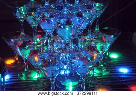 Pyramid Of Glasses With Light.