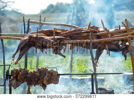 Fried Carcasses Of Cows Over A Fireplace At The Festival Of Historical Reconstruction Of The 11th-13