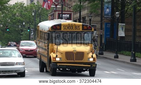 School Bus Driving Throgh Atlanta Midtown - Atlanta, Georgia - April 22, 2016