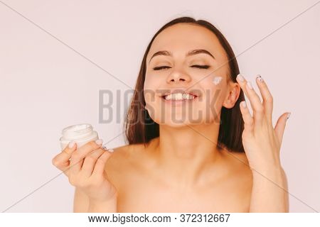 Portrait Cheerful Attractive Girl Apply Moisturizing Lotion On Face And Have Fun Isolated White Back