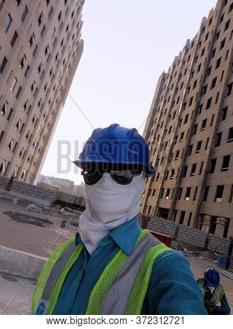 Bangalore, Karnataka/india - June 3 2020: Construction Worker Covering Cloth On Face As Protective M