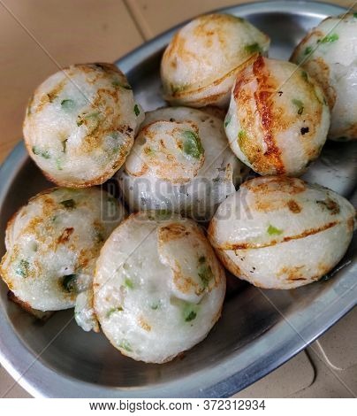 Close Up Of Plate Full Of South Indian Snack Made By Steaming Batter Is Known By Various Names, Incl