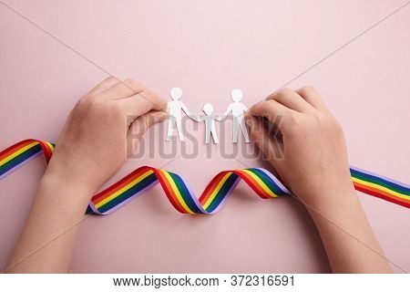 Homosexual Family. Different Kind Of Family. Paper Cut Family Simbol With Raindow Ribbon And Kid Han