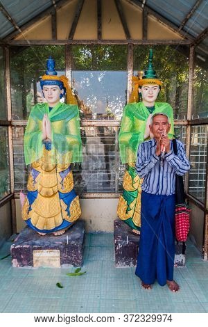 Yangon, Myanmar - December 15, 2016: Local Man Performing A Ritual At Botataung Paya Pagoda In Yango