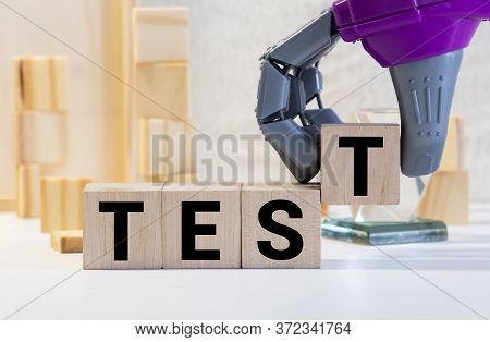 Wooden Blocks Spell Out Test On A Blue Bubble Or Scantron Sheet With A Number Two Yellow Pencil.