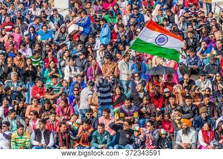 Wagah, India - January 26, 2017: Crowd Of Indian Spectators Watch The Military Ceremony At India-pak
