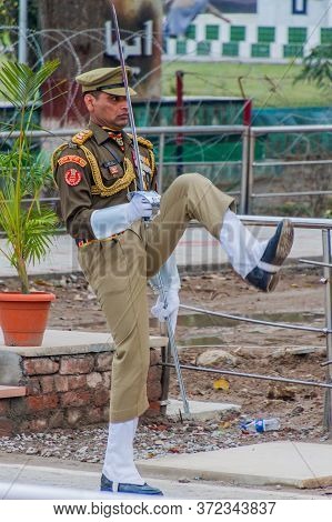 Wagah, India - January 26, 2017: Border Guard Watched By Indian Spectators At The Military Ceremony 