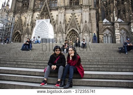 German People And Foreign Travelers Travel Visit And Respect Praying God At Cologne Cathedral Or Hoh