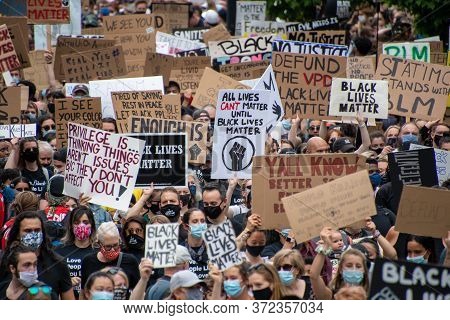 Junteenth     Protestors Holding Up Signs During Anti-racism March.   Vancouver  Bc Canada    June 1