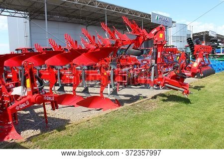 Kyiv, Ukraine - June 16, 2020: Large Disc Plough Unlu, Towing For Tractors To Plow Fields, Against T